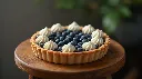 Generate an image of Blueberry open tart garnished with piping cream medium size plated in wooden table small size.webp